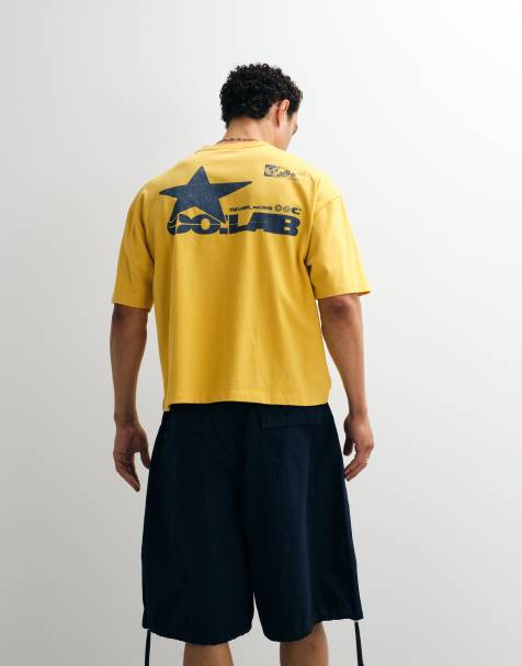 ASOS DESIGN – Żółty pudełkowy T-shirt oversize z grafiką w miejskim stylu - view 1