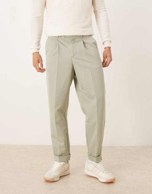 ASOS DESIGN – Zwężane eleganckie spodnie o luźnym kroju z podwijanymi mankietami w szałwiowozielonym kolorze