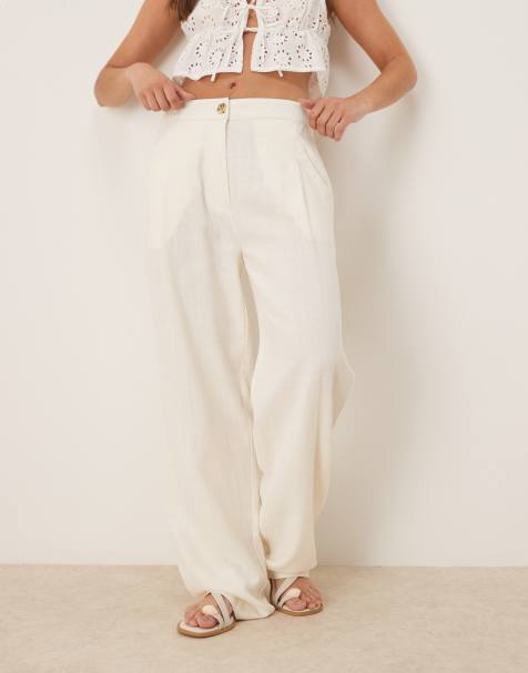 ASOS DESIGN pleat front tapered trousers with linen in cream