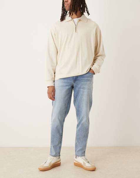 ASOS DESIGN stretch tapered fit jeans in mid wash blue