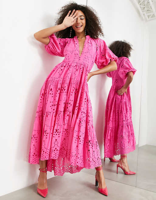 Pink dress shop with buttons