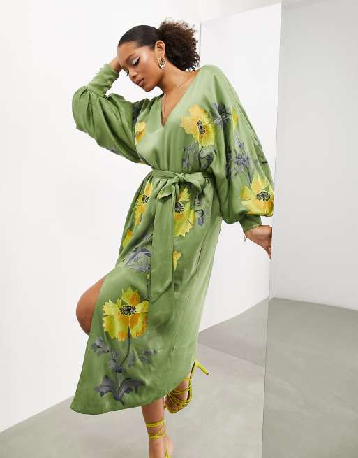 Premium Photo  A model wears a green kimono with a black bra and