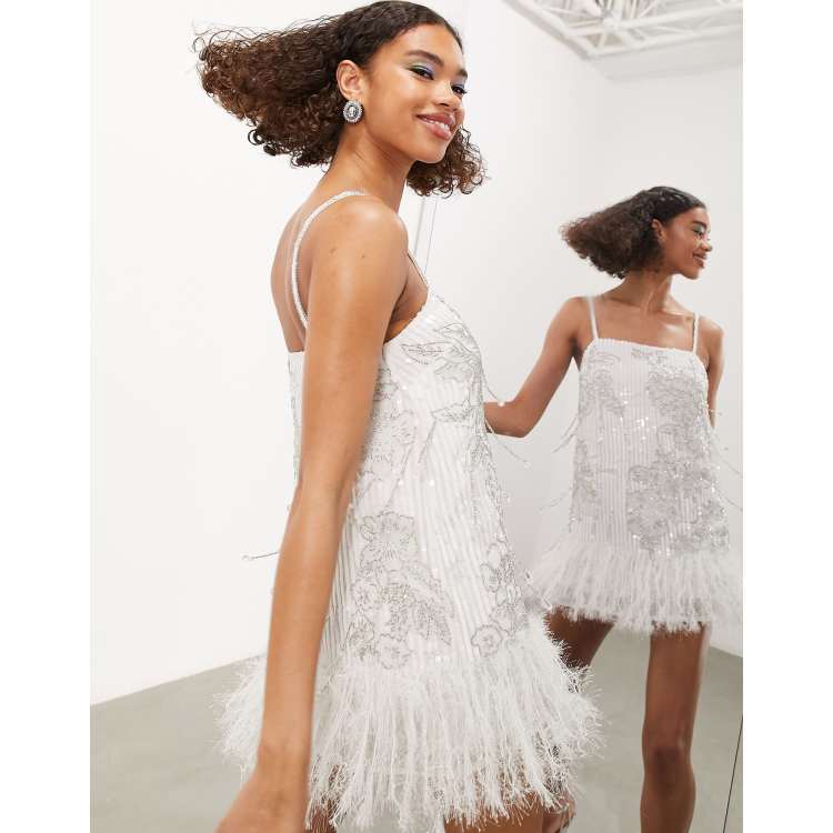 White sequin shop dress with feathers