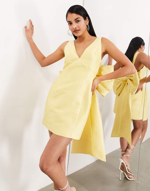 ASOS EDITION Robe courte structuree avec n ud oversize Jaune