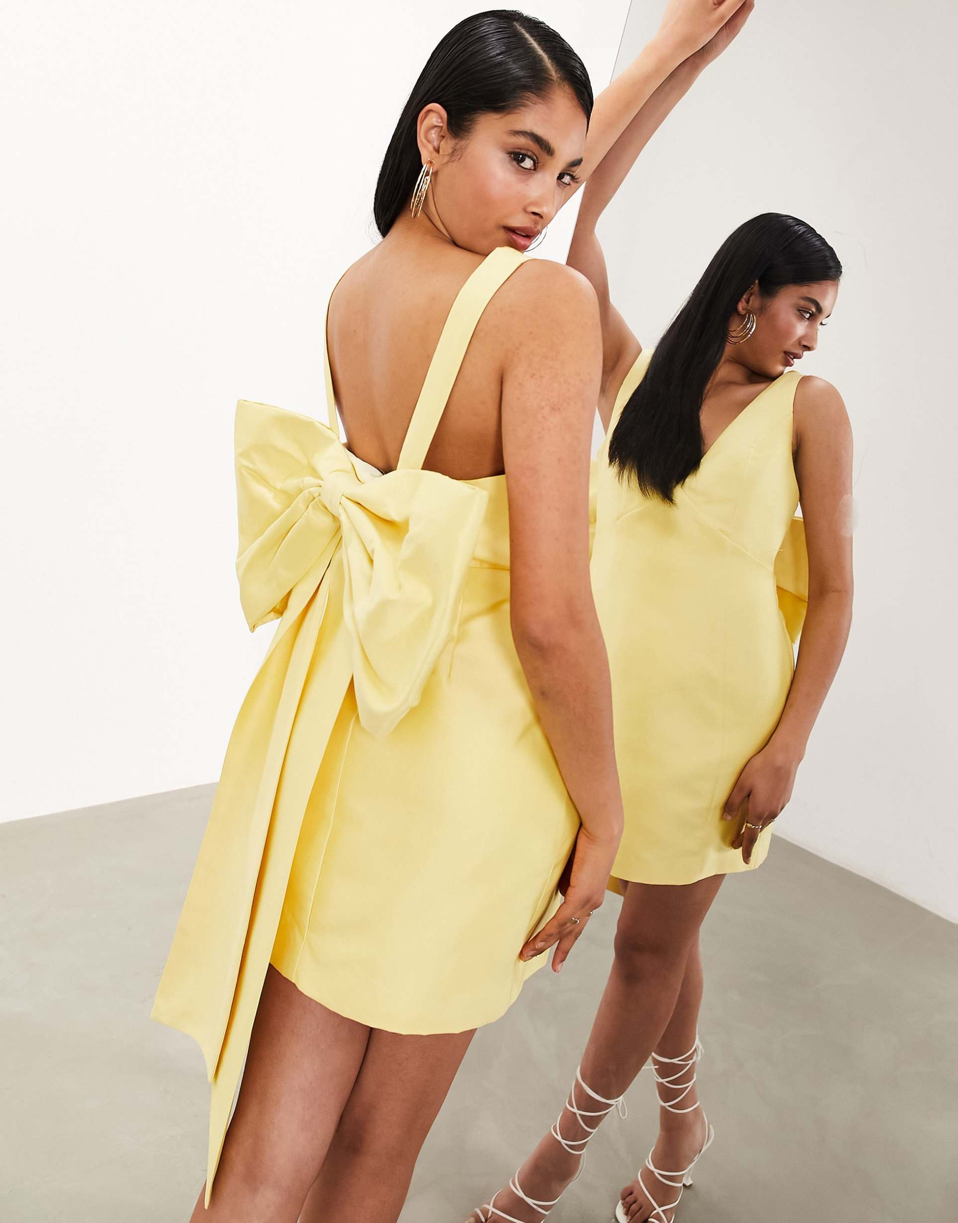 asos edition structured mini dress with statement bow back detail in yellow