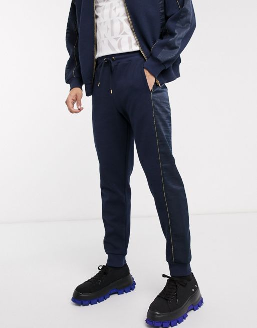 ASOS EDITION two-piece tapered sweatpants with satin panels in navy | ASOS