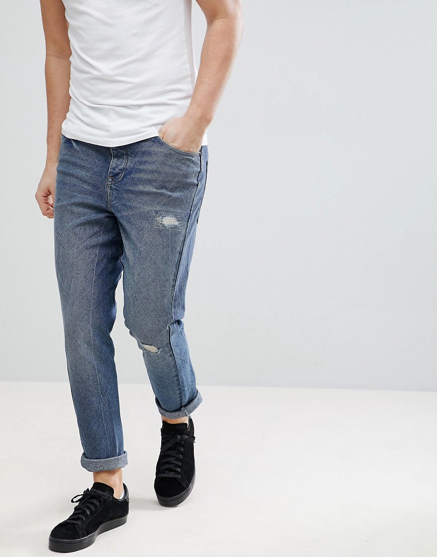 ASOS - Jeans skinny ritorti lavaggio blu scuro con strappi e rattoppi