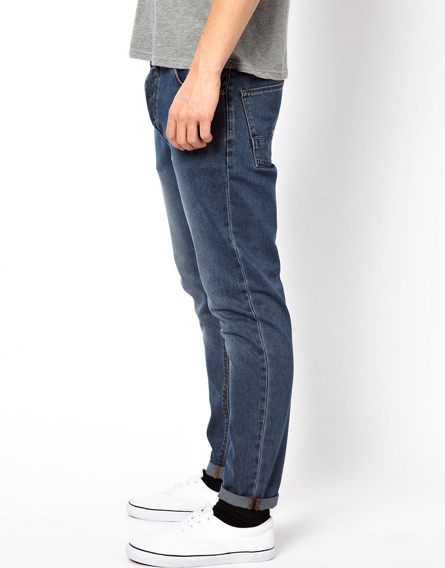 ASOS - Jeans stretti in fondo a lavaggio medio-Blu