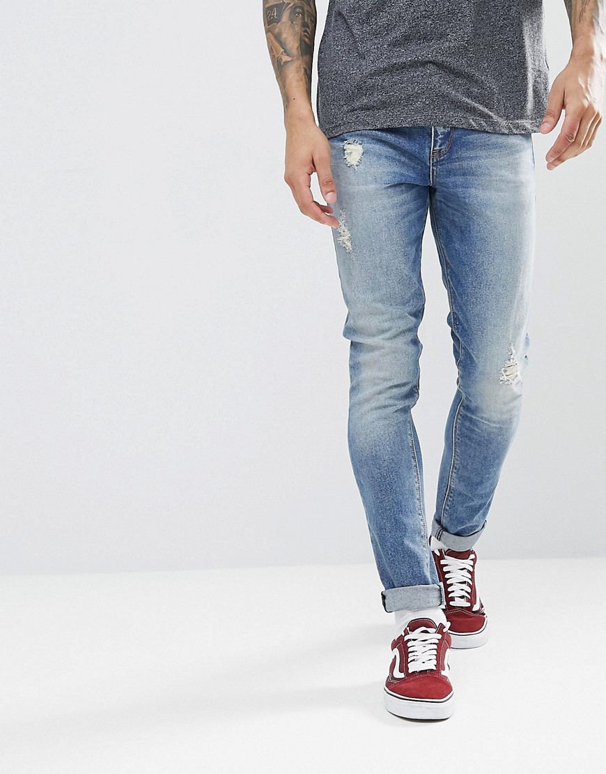 ASOS - Jeans super skinny blu medio délavé con abrasioni