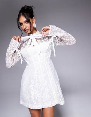 jacquard lace long sleeve caged mini dress in white