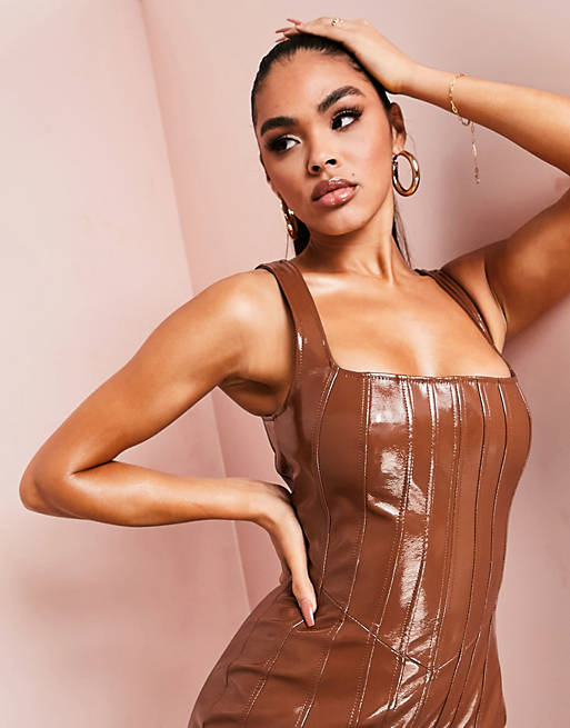 Women leather look jumpsuit with seam detail in brown 