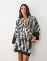 ASOS LUXE oversize dogtooth mini skirt with decorative buttons and contrast hem in mono
