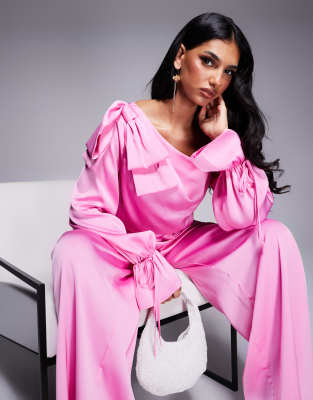 satin off the shoulder wide leg jumpsuit with bow in pink