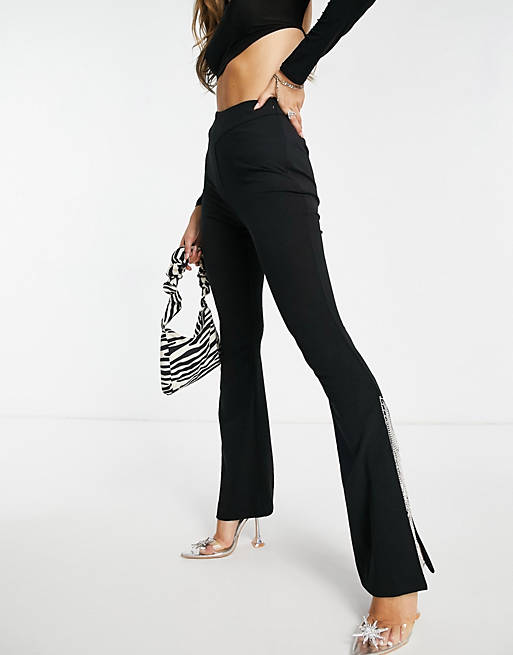 Women slim trousers with diamante hem in black 