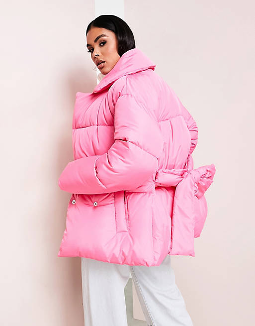 Women wrap puffer coat in hot pink 