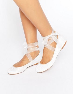 white ballet shoes with ribbon