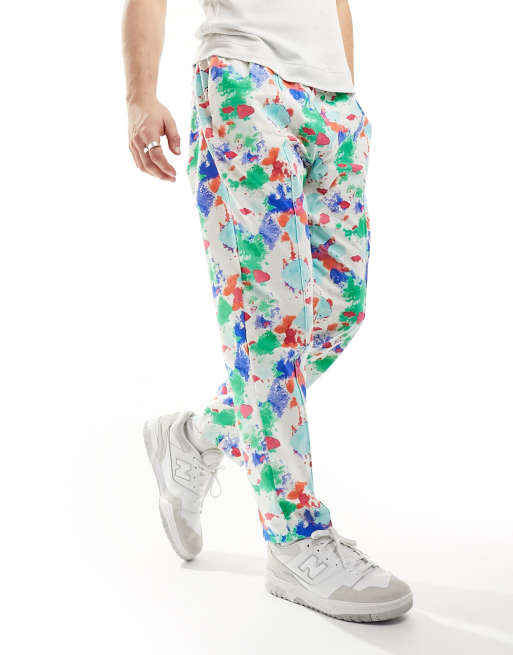 ASOS Made In Kenya - Toelopende broek in spetterprint