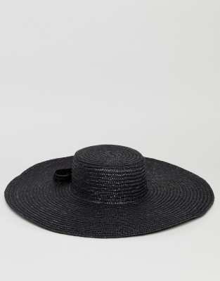 white floppy hat with black bow