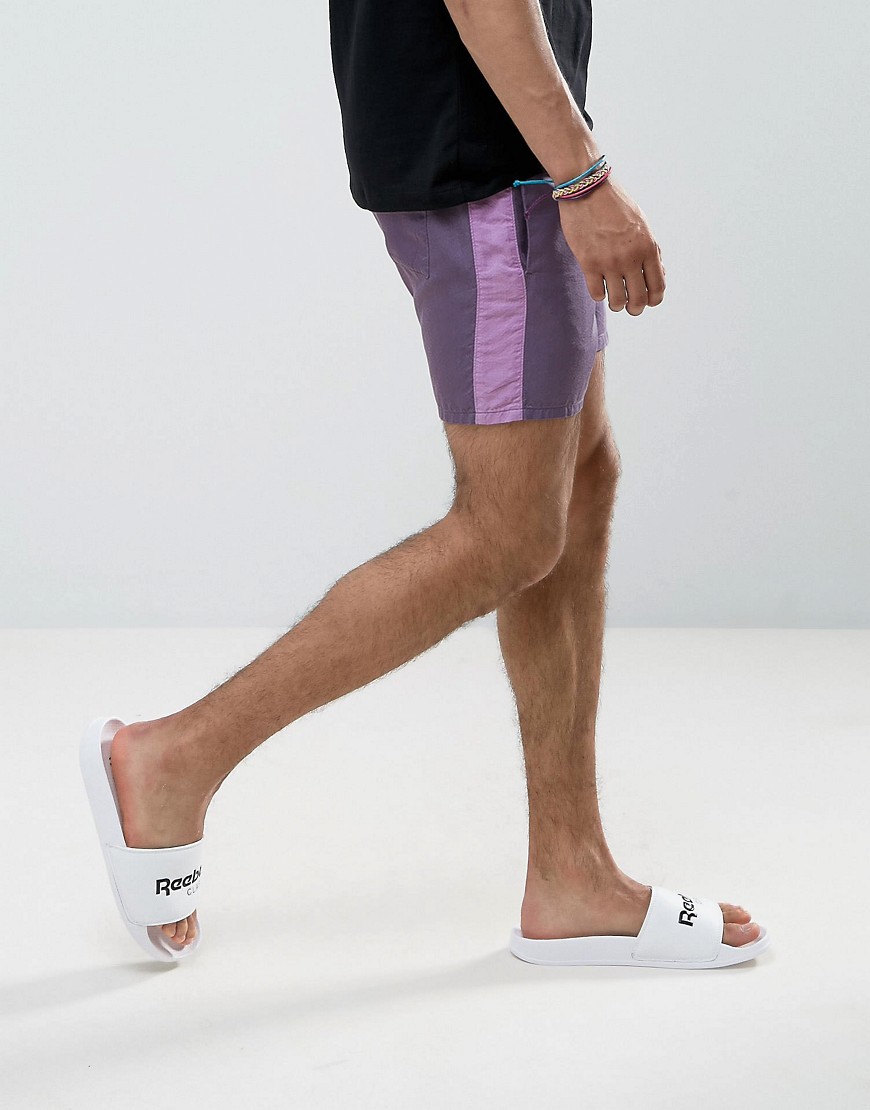 ASOS - Pantaloncini slim da corsa viola con riga laterale a contrasto