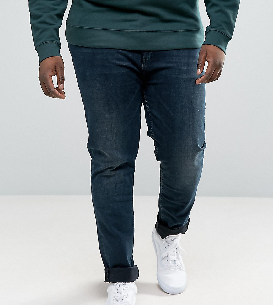 ASOS PLUS - Skinny jeans met donkerblauwe wassing