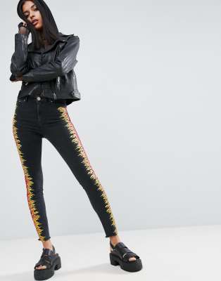 black jeans with white flames