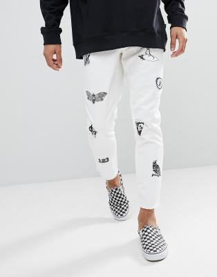 white jeans with patches