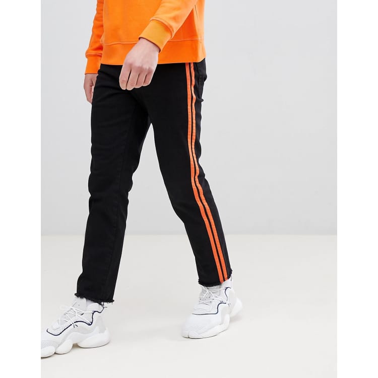 Black sweatpants best sale with orange stripe