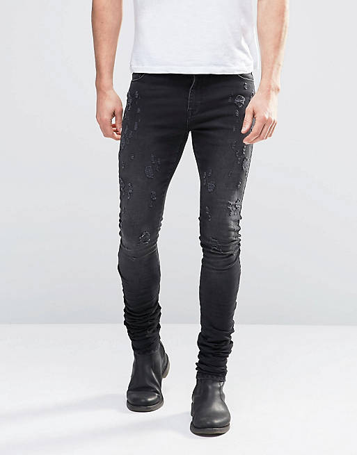 ASOS Super Skinny Longline Stacker Jeans With Abrasions In Black | ASOS