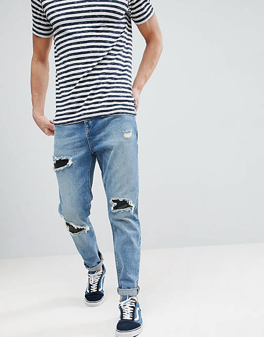 ASOS Tapered Jeans In Mid Wash Vintage With Faux Leather Rip & Repair