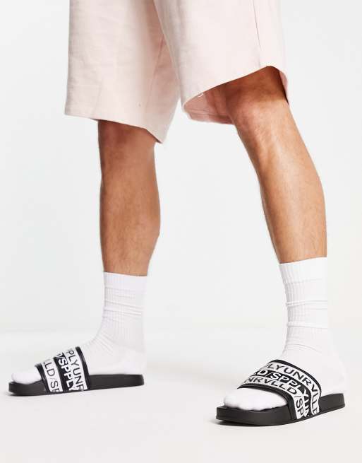 ASOS Unrvld Spply sliders in black and white