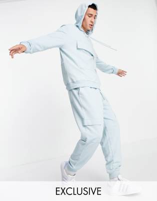 ASOS Unrvlld Spply co-ord relaxed joggers with logo print and cargo pockets in blue