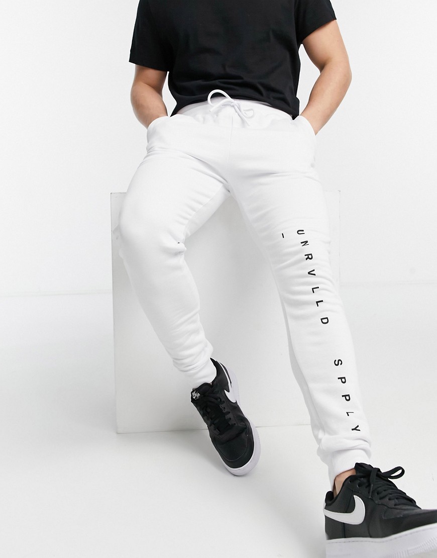 ASOS Unrvlld Spply co-ord relaxed joggers with printed logo in white