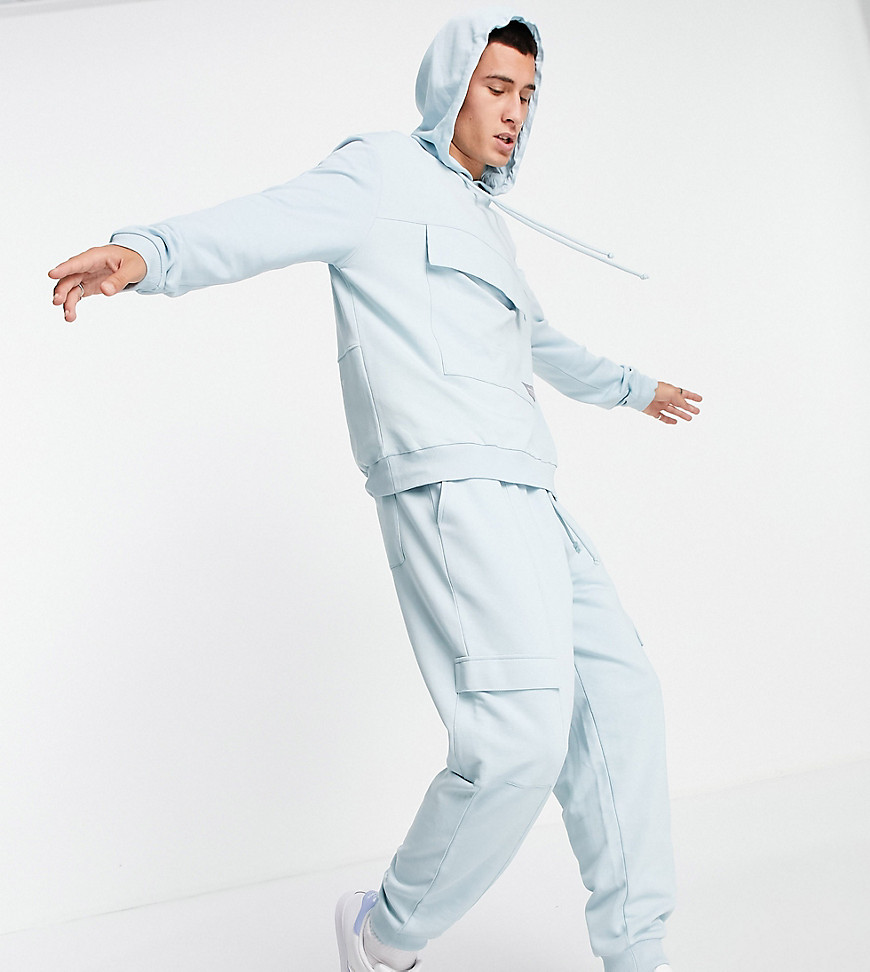 ASOS Unrvlld Spply matching relaxed sweatpants with logo print and cargo pockets in blue-Blues