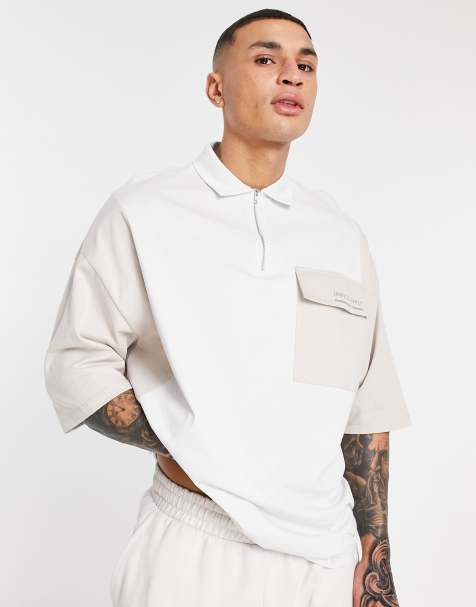 ASOS Unrvlld Spply oversized half-zip polo with cut-and-sew and logo print