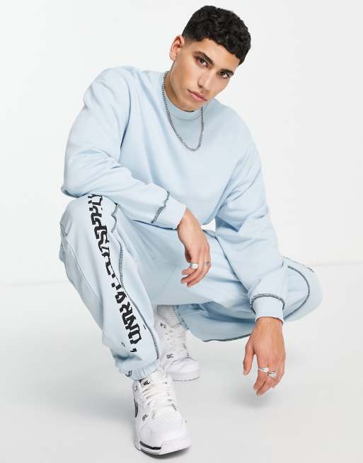 ASOS Unrvlld Spply - Oversized joggingbroek met logoprint en naden aan de voorkant in lichtblauw