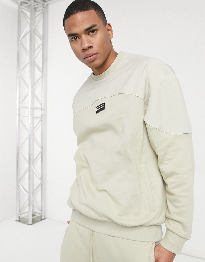 ASOS Unrvlld Spply oversized sweatshirt in beige with nylon color block panels-Neutral