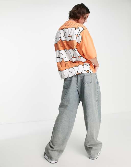 ASOS Unrvlld Spply – Pomarańczowy T-shirt oversize z wypukłym nadrukiem w stylu graffiti