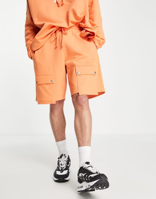 ASOS - Unrvlld Spply - Short long d'ensemble en jersey avec poche - Orange vif, 2 de 4