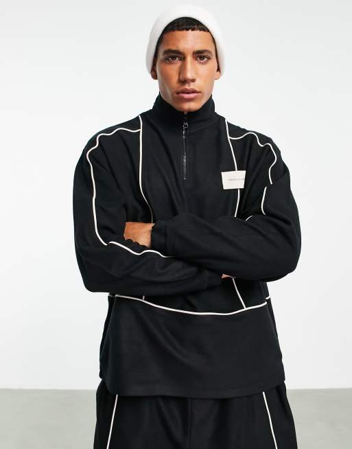 ASOS Unrvlld Spply – Sweatshirt i polarfleece och oversize med kort dragkedja, kantband och märkeslogga