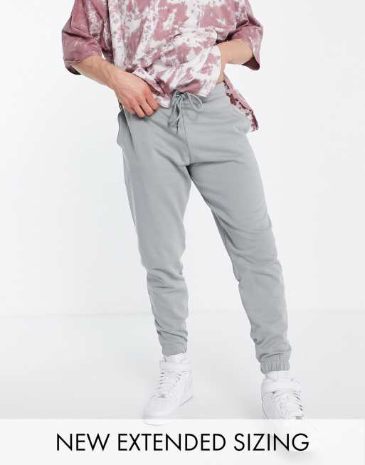 ASOS - Unrvlld Spply - Toelopende joggingbroek met logoprint in grijs, deel van co-ord set