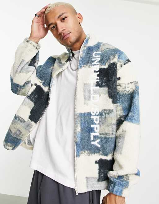 ASOS Unrvlld Spply - Veste oversize duveteuse imitation peau de mouton avec motif abstrait et imprimés logos