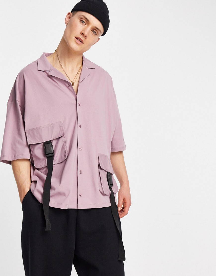 ASOS Unrvlld Supply button through jersey shirt with utility pockets & strapping detail with logo sleeve print-Purple