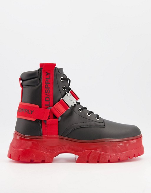 ASOS Unrvlld Spply lace up boot in black faux leather with red tape detail on chunky sole