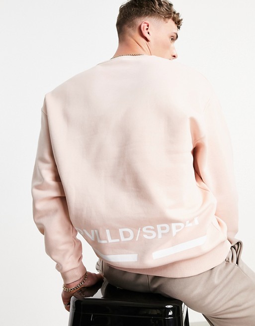 ASOS Unrvlld Spply oversized sweatshirt in pink