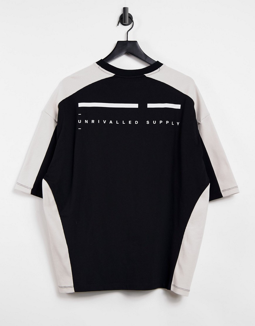 ASOS Unrvlld Supply oversized t-shirt with printed logo in black and white colourblock