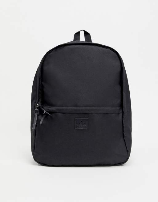 ASOS - Unrvlld Supply - Rugzak in zwart met logopatch