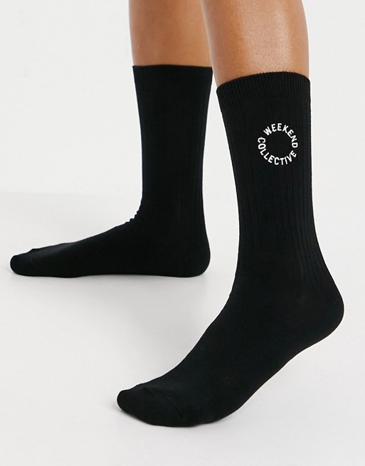 ASOS Weekend Collective calf length rib sock with embroidered logo in black
