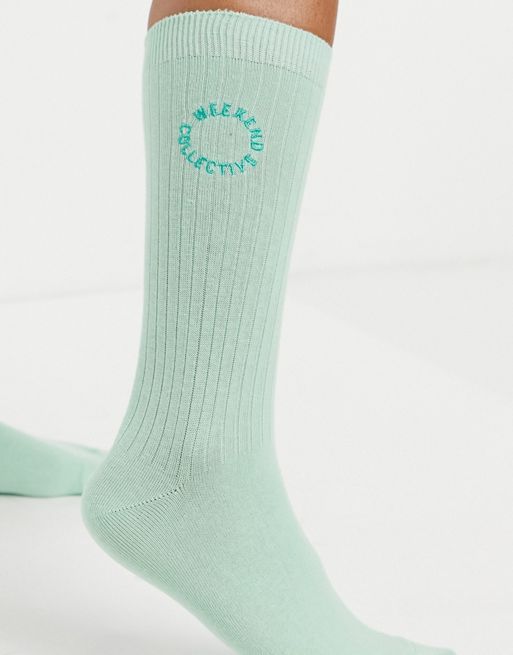 ASOS Weekend Collective calf length socks with embroidered logo in white