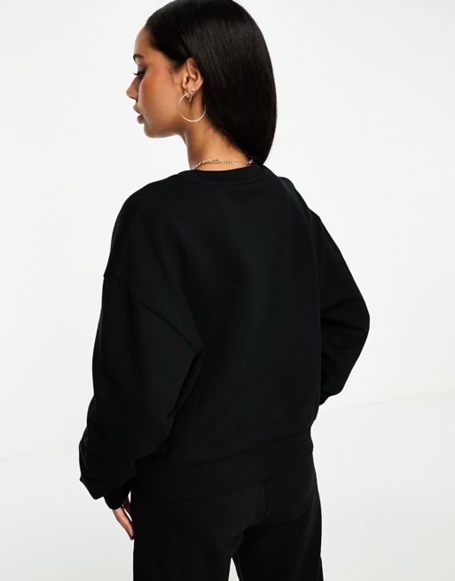 ASOS Weekend Collective oversized sweatshirt with woven logo in black