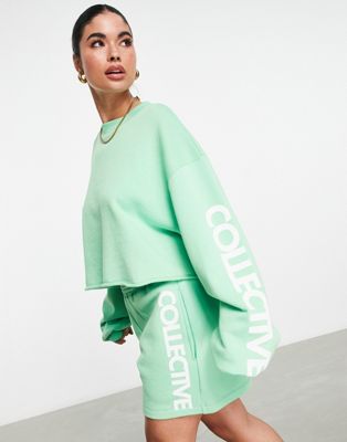 ASOS Weekend Collective cropped sweatshirt with sleeve graphic in apple green